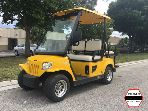 Yellow Tomberlin 4 Passenger Golf Cart