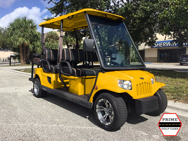 Yellow Tomberlin 6 Passenger Golf Cart